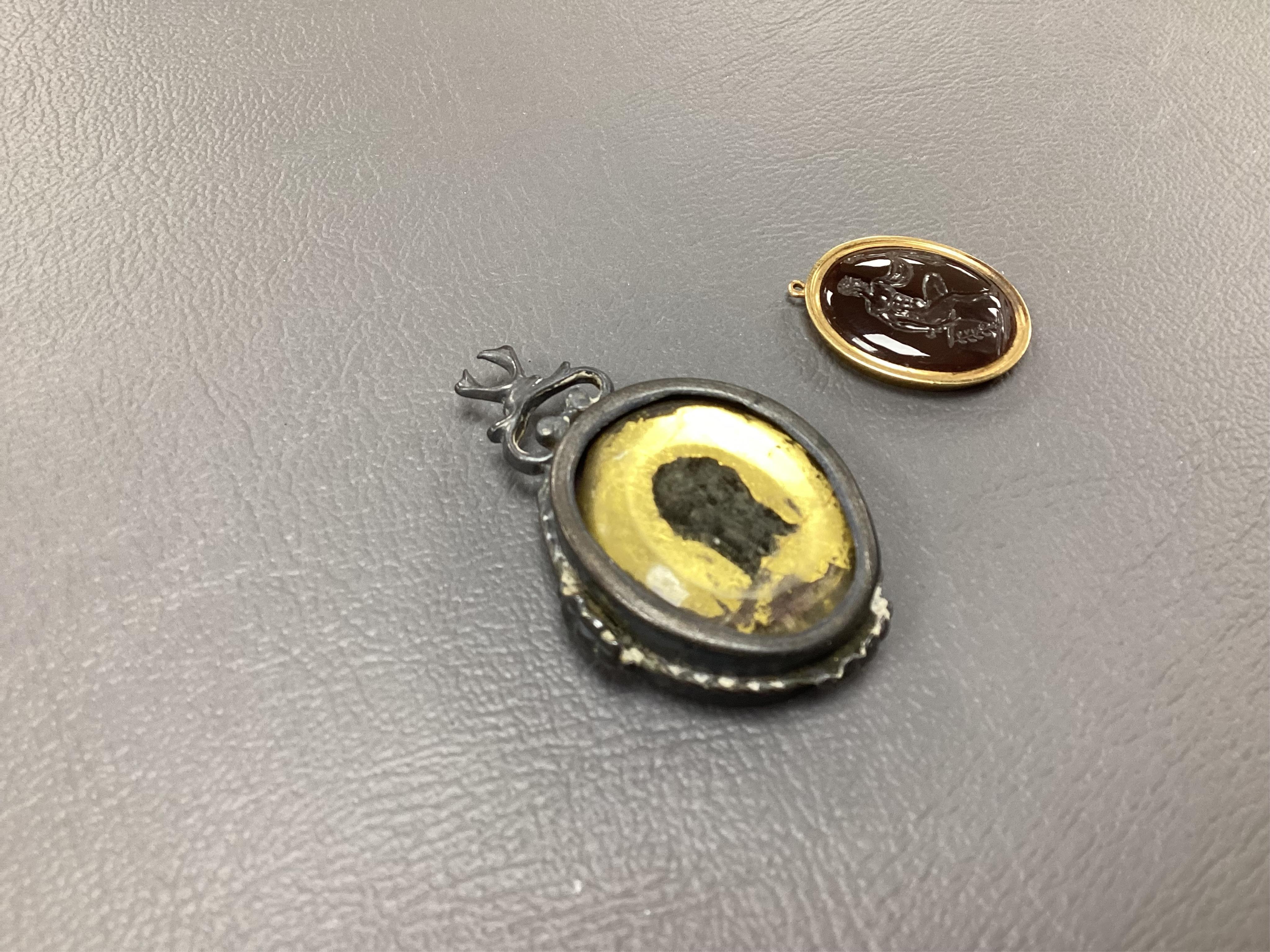 A 19th century yellow metal mounted intaglio pendant, assorted unmounted cameos, snuff box and collectables. Condition - varies